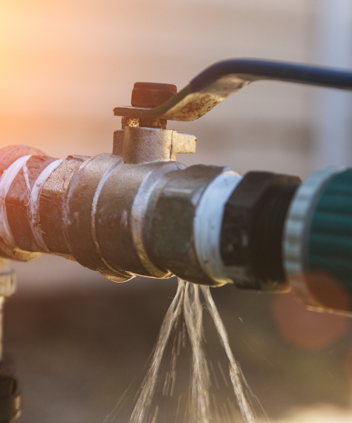 A close up of a faucet with water coming out of it